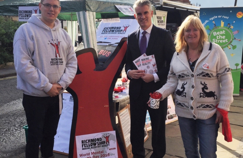 World Mental Health Day stalls at Sudbury market. Matt Webb and Julie Revett from Richmond Fellowship with South Suffolk MP James Cartlidge 