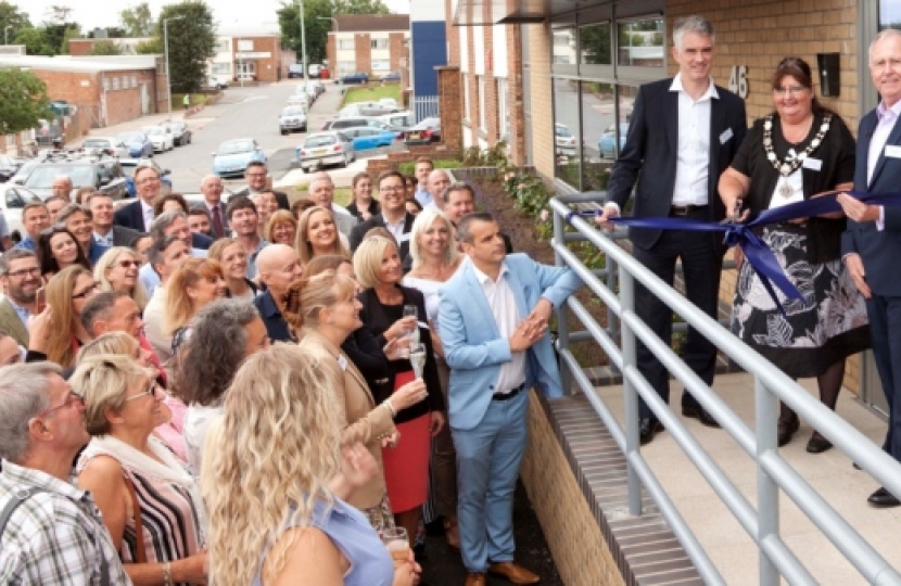 Ribbon cutting at Challs' new offices with (L to R) South Suffolk MP James Cartlidge, Mayor of Hadleigh Yvonne Free and Challs managing director Graham Burchell