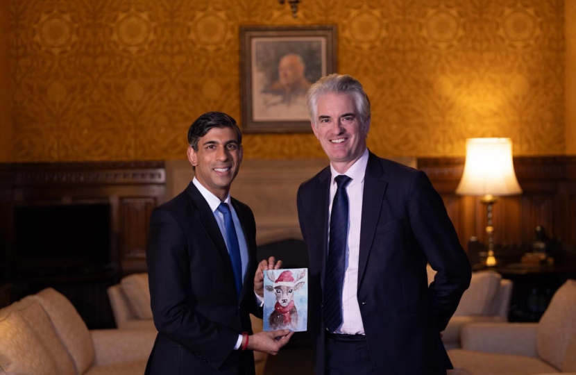 James presenting the winning design to Prime Minister Rishi Sunak