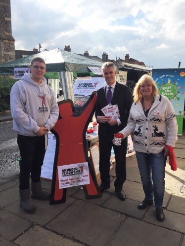 World Mental Health Day stalls at Sudbury market. Matt Webb and Julie Revett from Richmond Fellowship with South Suffolk MP James Cartlidge 