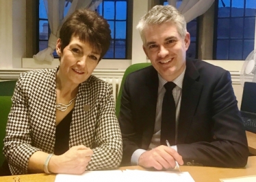 Jo Churchill and James Cartlidge have signed the agreement to develop more homes.