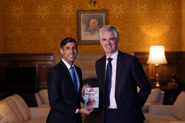 James presenting the winning design to Prime Minister Rishi Sunak